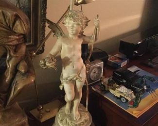 Elegant angel plant holder holding breath in one hand and vine of flowers in the other Is 22 inches tall $45 SALE $35.00 SALE $30.00