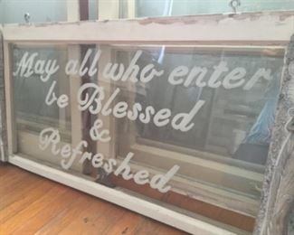 On an old window with hooks added for hanging