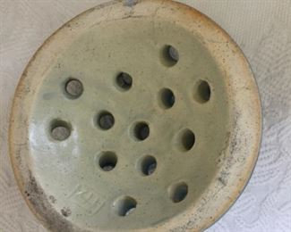 Base of frog marked with impressed logo