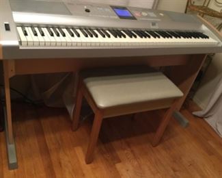 Yamaha keyboard with all the electronica fun you could possibly want and bench included