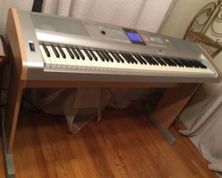 Cover included but it’s so so, Selling at 300.00 to 550.00 identical model used online our price $200.00 deal, great for kids learning piano, easier to press keys and all the background beats available. SALE $175.00
