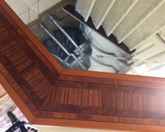 Detail of beautiful wood inlay on octagonal mirror