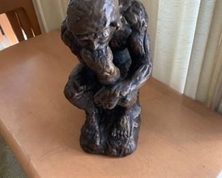 The Thinker by Rodin.  Scaled down copy of the original done in Plaster by Austin Productions, Inc. of Hollbrook, New York.  Circa 1970's.  Small chip in painted surface. Offered at $55