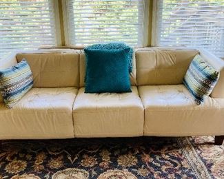 Cream Chateau Sofa  D'ax Massimo ===> $ 900                               Dimensions: 91"L x 38"W x 34"H                                                             
*Three-seat design
*Tufted back and foam-filled cushions
*Track arms
*Tapered legs
Manufacturer's 