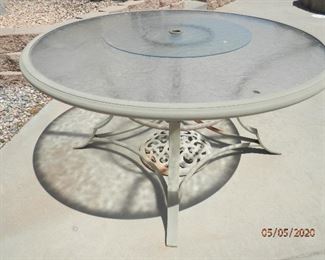 54 inch embossed glass top umbrella patio with lazy susan ***$65.00***     Cast iron ornamental umbrella base ***$10.00****    Call Now (760) 975-5483  DJ