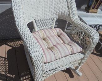 1 of 2 matching white rattan rockers