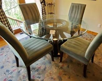 $300 - Glass top table & 4 chairs (pretty shade of a lighter green color) Table is 54" in diameter and 29 1/2" tall.