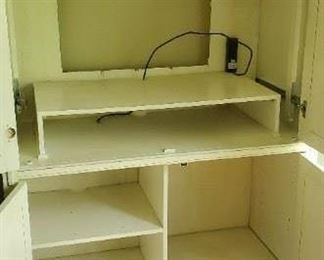 4 door media cabinet 67” tall x 49” W x 23” Deep. 40” inside clearance