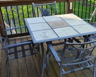 $75 - Aluminum & tile top patio table & 4 chairs Table is 39" x 39" x 28"tall