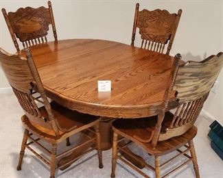 $100 - Dining table & 4 chairs (one leaf included as shown in picture)