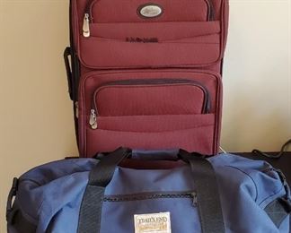 $16 - Maroon luggage is 16" x 24" and Blue duffel bag is 24" across