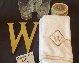 $12 - "W" Lot - The large 'W' wall hanging is brass. Hand towels are made by Santens (like new). Coasters are sandstone.