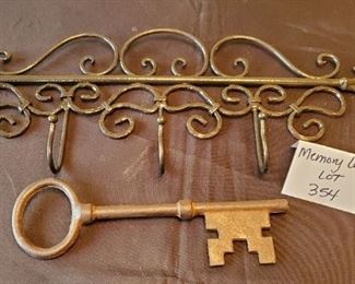 $15 - Wall coat rack (21.5") and a 10.5" heavy metal key