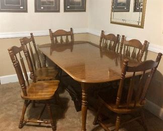 Large dining table with 6 matching chairs, gold framed mirror and framed art