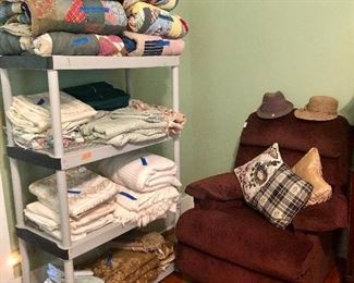 La-Z-Boy recliner, hats, vintage quilts and sheets