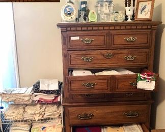Stanley 6 drawer chest, small shelf is full of crocheted doilies and photo albums