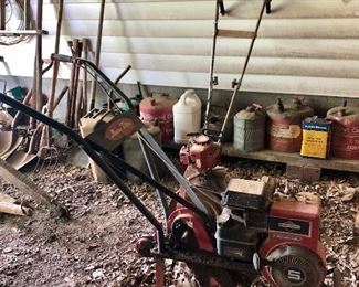 Large and small tiller, old gas cans...