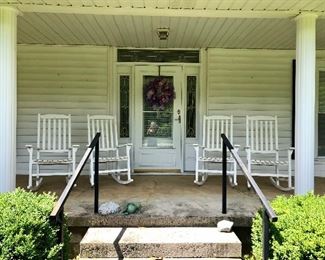 Four white wood rockers, decorative wreath