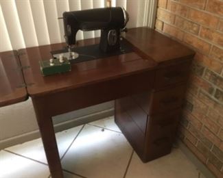Vintage sewing machine & cabinet plus accessories  $65