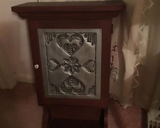 Small curio hanging cabinet with tin carved door  $45