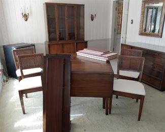 $225. Drop leaf table with 3 leaves and table pads. Pads are able to protect the wood but not in good condition