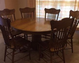 Claw foot oak round dining table with 6 chairs!