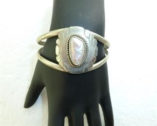 Large iridescent mother-of-pearl sterling cuff bracelet.  Marked "hecho en Mexico" and 925.  Adjustable.  $128