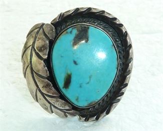 Size 7.5  and weighs 13 grams.  It is a large ring, measuring 1.25 inches tall and wide. This is an old one,  unmarked, with a beautiful stone and in excellent condition.  $115