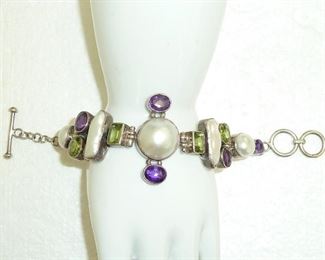 This Sterling silver bracelet is so yummy!  Amethyst, peridot, and genuine pearls, oh my.  It is a big chunky well-made piece, with the center measuring 1.5" wide.  $235