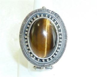 HUGE Tiger's eye Sterling silver POISON ring!  1 3/4" by 1 1/8" across the face.   This is a fabulous handmade artist piece.   Size is adjustable.  $335