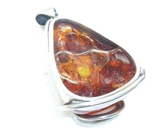 Backside of huge amber and mother-of-pearl pendant.  Set in Sterling silver.  $185
