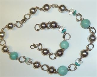 This is an artist handmade Sterling silver and turquoise set, probably from the seventies.  Very mod, with clear acrylic accents and smaller beads that add movement.  You can see where each individual silver bead was hand crafted.  Beautiful. 107g total weight for necklace and bracelet. $295