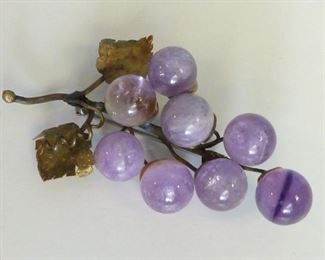 Genuine polished amethyst grape brooch with brass leaves from the 1930s.  2.5" long.  $88
