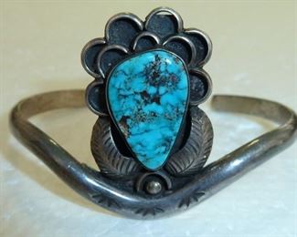 Marked DS 1911 J.F. on the back.  Hand stamped sterling silver with beautiful turquoise.  1 1/2" tall.  $185