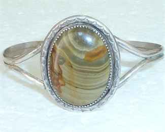 Signed SL.  Vintage petrified wood agate cuff bracelet.  Hand stamped silver Native American from the sixties or seventies.  Face is 1 3/8" tall.  $165