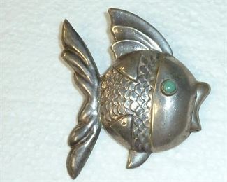 Love this fish!  Marked PLATA, STERLING and 925.  Turquoise eye and lots of personality.  Big 2.25" tall and wide.  $99