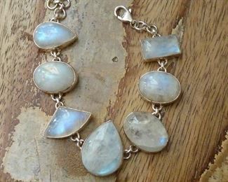 One inch wide chunky Sterling silver and moonstone bracelet with lots of blue fire.  Signed SJ and 925.  $165