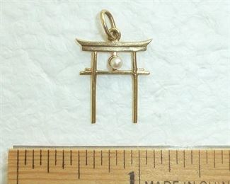 Signed MIKIMOTO pearl and 14k gold charm or pendant.  $125