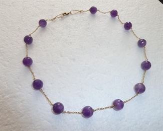 Gold filled 18" necklace with faceted genuine amethyst beads and single pearl accent at clasp.  $89