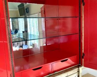 red interior of mirrored armoire/bar