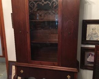This vintage china cabinet had lots of storage and great details. On top of the cabinet you will see vintage brass and a wonderful old clock