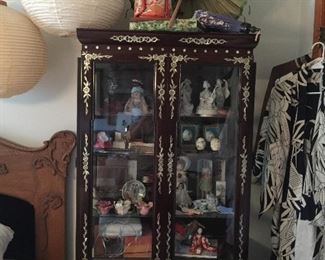 In the guest room you will find this incredible Mother of Pearl inlay Oriental lighted display cabinet 
