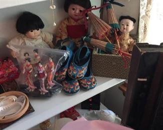 Vintage dolls, silk shoes, shells and corals