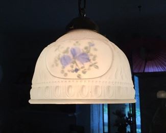 A close look at one of the hand painted glass shades