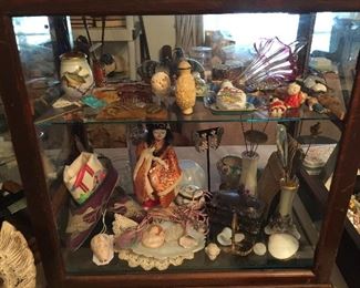 In the second showcase you will find, vintage dolls, cameos, artist hand made jewelry, Antique hat pins, cloisonne birds, snuff bottles, enamel pieces, King Fisher wing crab pin, vintage hair combs, vintage silk shoes and textiles.