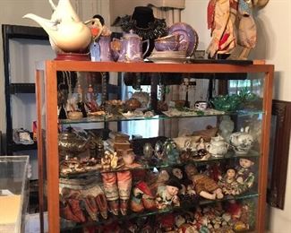 This large showcase contains the most beautiful collection of vintage Japanese dolls ranging from babies to adults.  Bound feet shoes, silk shoes and hats. Costume jewelry, swan salts