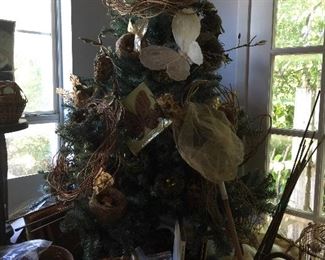 Christmas Tree displaying decorative nests, butterflies and art