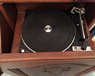 The console stereo's turntable has been replaced with a Dual Turntable 