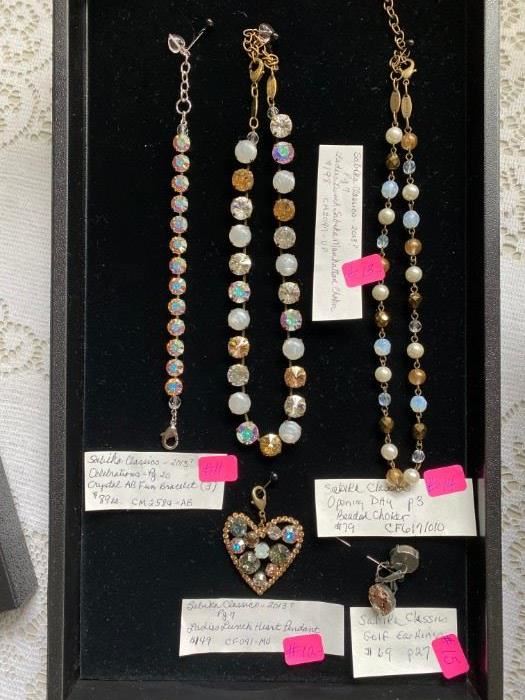 #11		SABIKA CLASSICS JEWELRY	Celebrations Cyrstal AB Fun Bracelet	$89
#12		SABIKA CLASSICS JEWELRY	Ladie's Lunch Heart Pendant	$149
#13		SABIKA CLASSICS JEWELRY	Ladie's Lunch Manhattan Choker	$198
# 14		SABIKA CLASSICS JEWELRY	Opening Day Beaded Choker	$79
# 15		SABIKA CLASSICS JEWELRY	Golf Earring	$69
