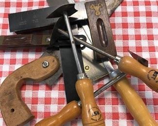 Assorted tools with wooden handles.